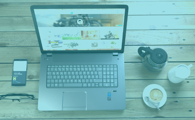 a laptop on a wood table